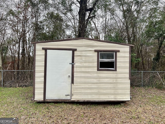 view of outdoor structure with a yard