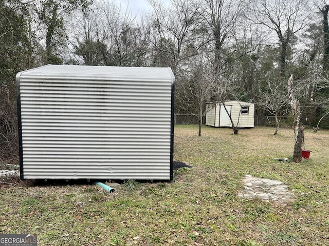 view of outbuilding featuring a yard