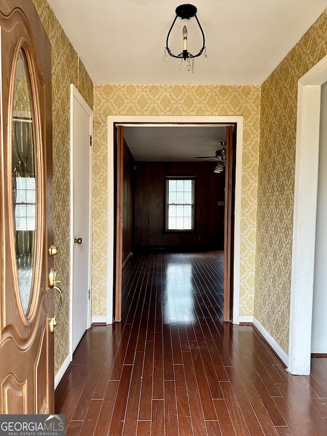 corridor with dark hardwood / wood-style floors