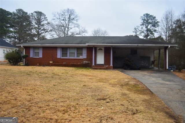 ranch-style home with a carport and a front lawn