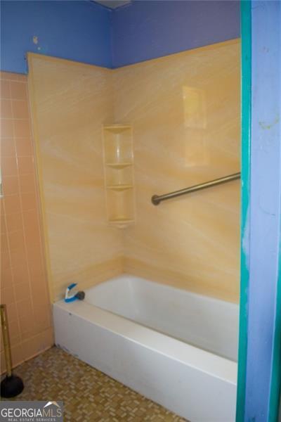 bathroom featuring bathtub / shower combination