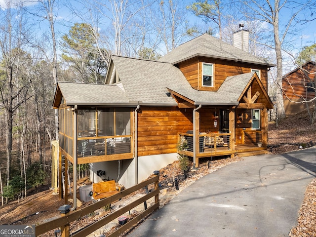 view of front of home with a sunroom