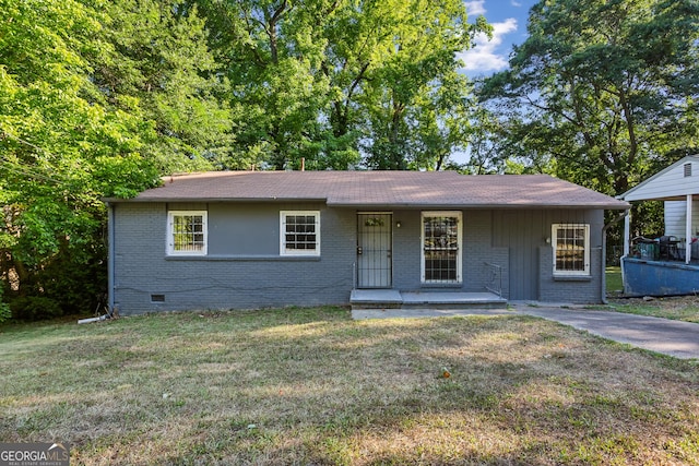 single story home with covered porch and a front lawn