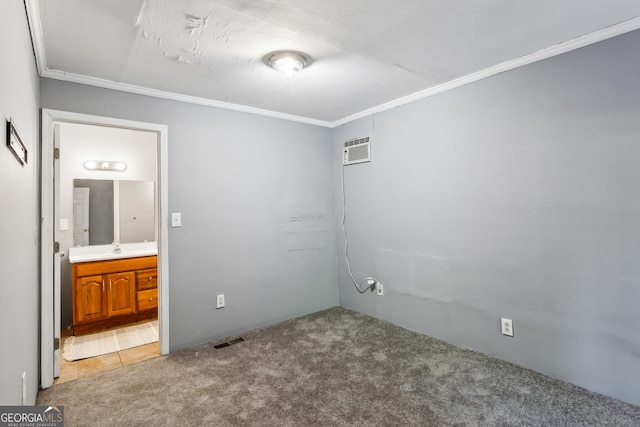 carpeted empty room featuring crown molding