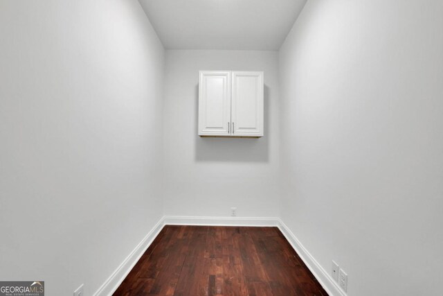 unfurnished room with hardwood / wood-style flooring