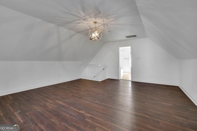 bonus room featuring lofted ceiling and dark hardwood / wood-style floors