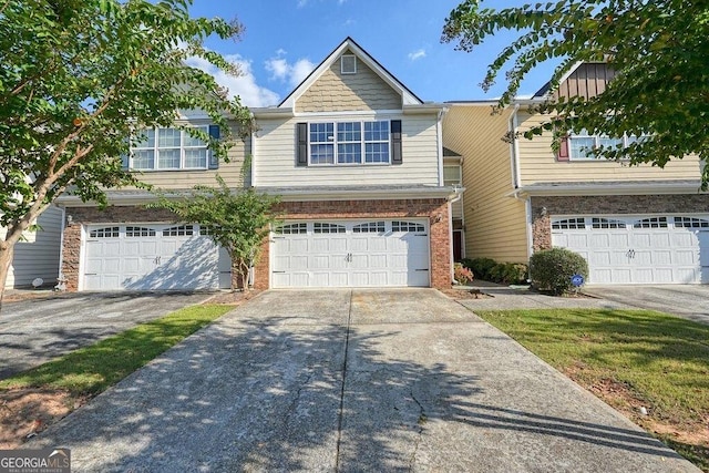 multi unit property featuring a garage