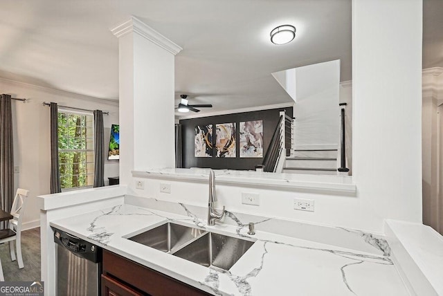 kitchen featuring light stone counters, sink, ornamental molding, and stainless steel dishwasher