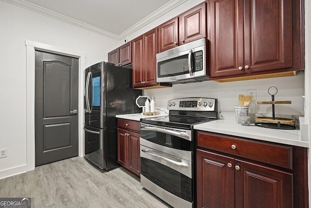 kitchen with crown molding, appliances with stainless steel finishes, and light hardwood / wood-style floors