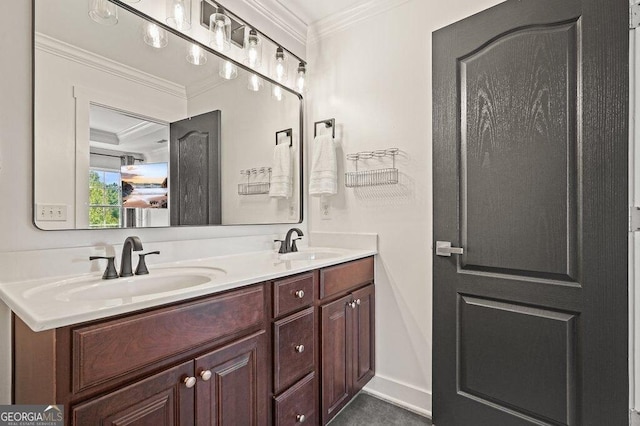 bathroom with crown molding and vanity