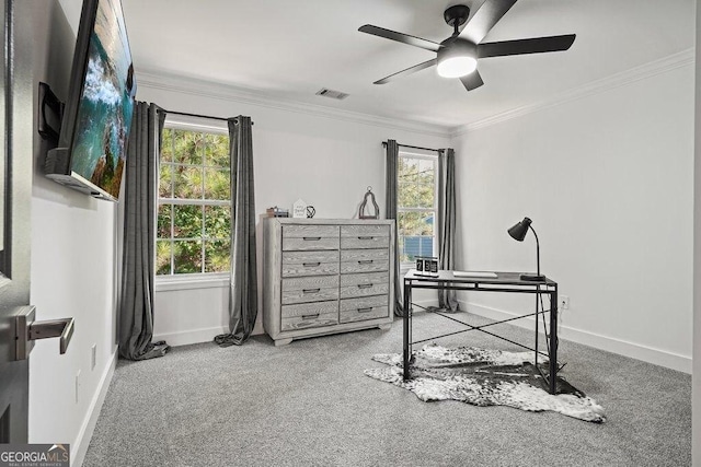 office area featuring ceiling fan, light colored carpet, and ornamental molding