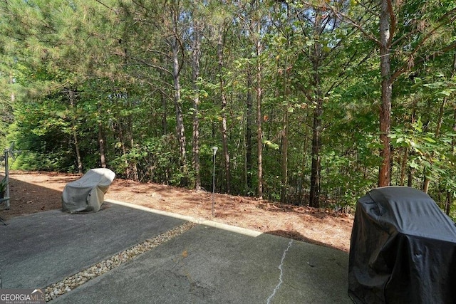 view of patio featuring a grill