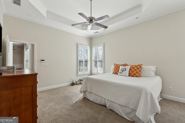 carpeted bedroom with ornamental molding, a raised ceiling, and ceiling fan