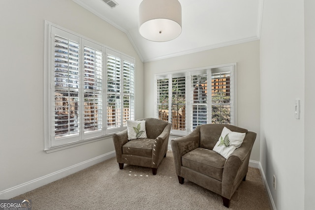 sitting room featuring vaulted ceiling, ornamental molding, and carpet floors