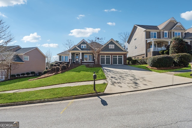 craftsman-style house featuring a garage and a front lawn