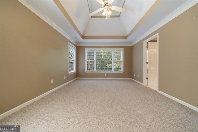 spare room with light carpet, high vaulted ceiling, ornamental molding, and ceiling fan