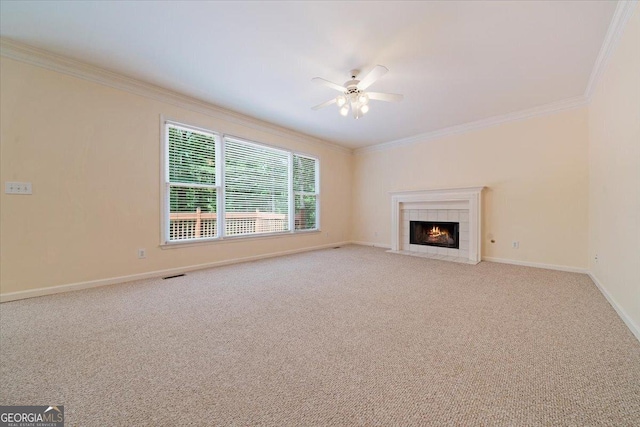 unfurnished living room featuring light carpet, ceiling fan, and ornamental molding