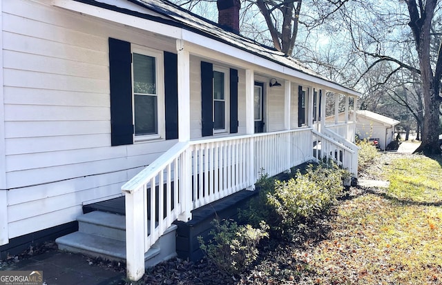 view of side of home with a porch