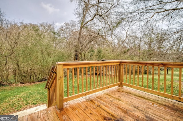 wooden terrace with a yard