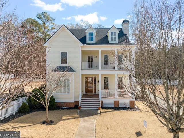 view of front of home featuring a balcony and covered porch