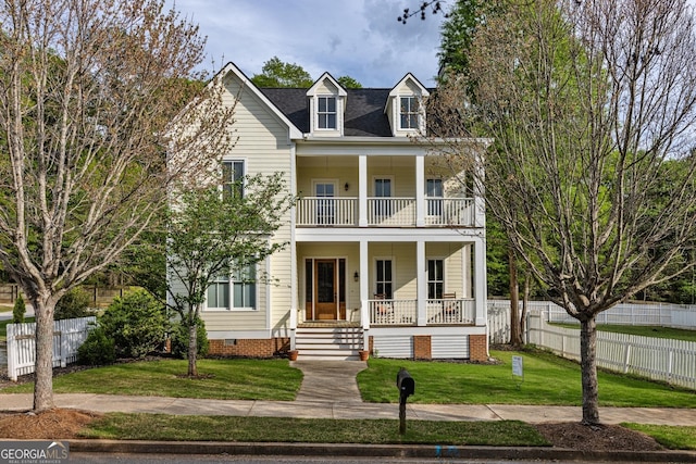 view of front facade featuring covered porch, crawl space, fence, a balcony, and a front lawn