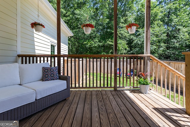 wooden terrace with outdoor lounge area