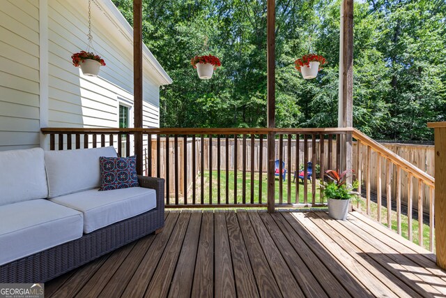 wooden deck with an outdoor hangout area