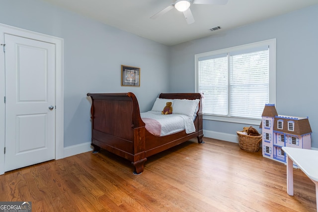 bedroom featuring ceiling fan and wood-type flooring