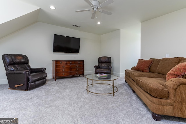 living room featuring vaulted ceiling, carpet, and ceiling fan