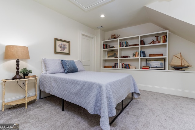 carpeted bedroom with vaulted ceiling