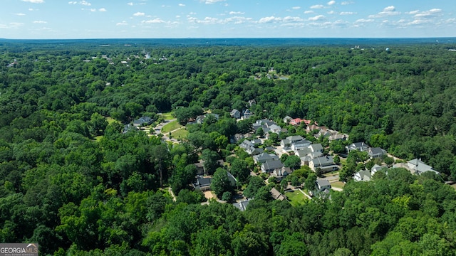 drone / aerial view featuring a view of trees