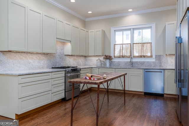 kitchen featuring sink, stainless steel appliances, white cabinets, and light stone countertops