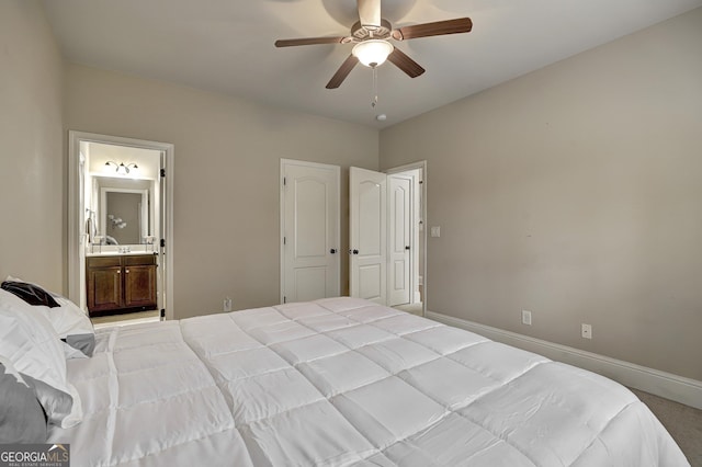 bedroom with ensuite bathroom and ceiling fan