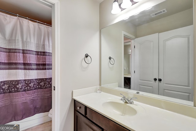 bathroom with vanity and toilet