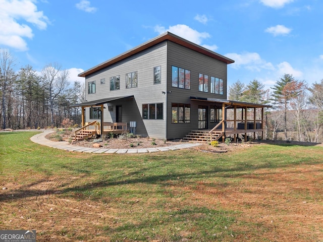 back of house featuring a yard and a porch