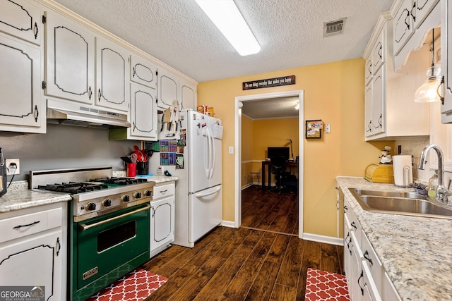 kitchen featuring dark hardwood / wood-style floors, sink, white cabinets, white fridge, and luxury stove