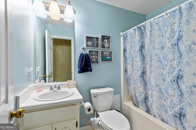 full bathroom with vanity, a textured ceiling, toilet, and shower / tub combo with curtain