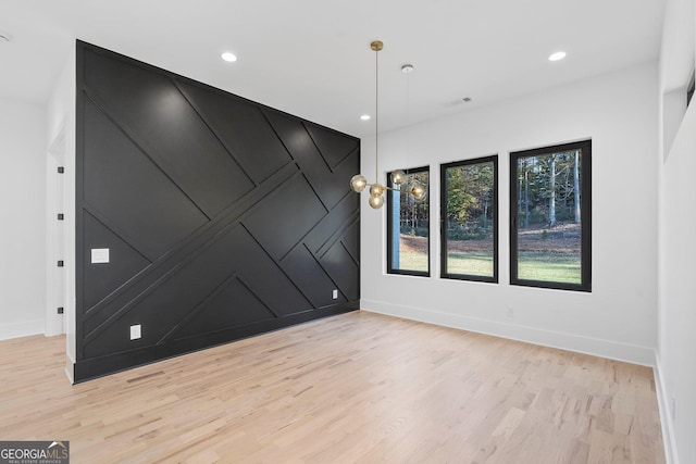 spare room featuring light wood-type flooring