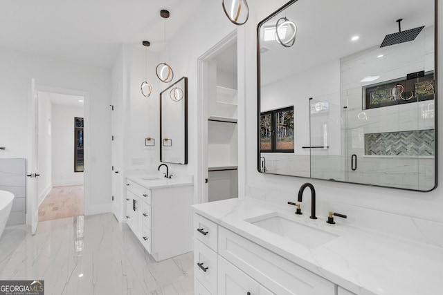 bathroom featuring vanity and an enclosed shower