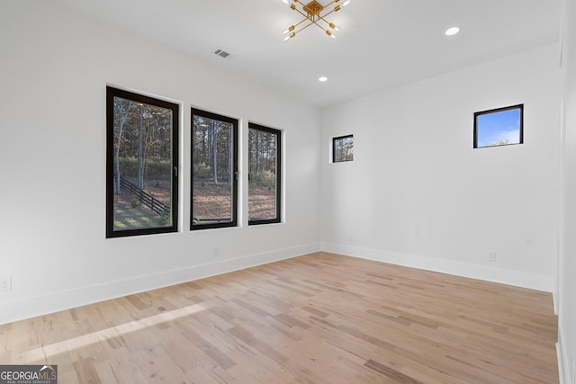 spare room featuring light hardwood / wood-style flooring