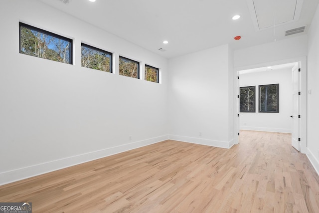 empty room with light hardwood / wood-style floors