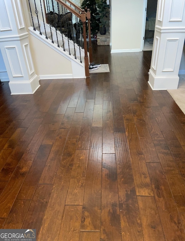 room details featuring baseboards and wood finished floors