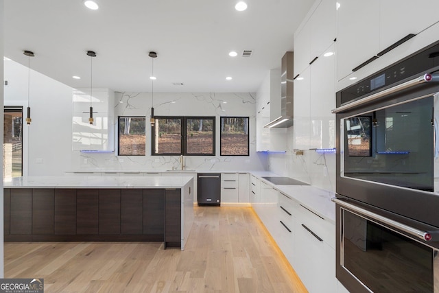 kitchen featuring white cabinetry, hanging light fixtures, black electric stovetop, dark brown cabinets, and stainless steel double oven