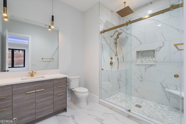 bathroom featuring vanity, toilet, and walk in shower