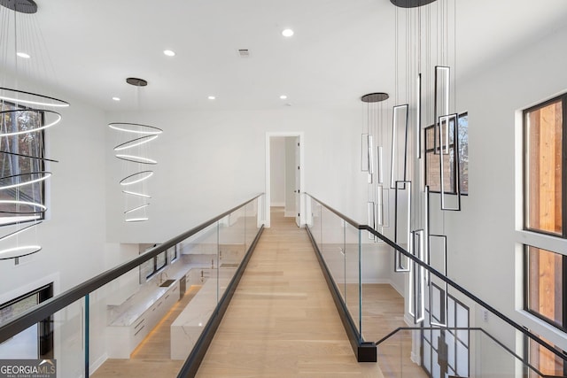 hallway with light hardwood / wood-style flooring