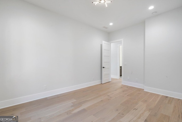 spare room featuring light hardwood / wood-style flooring