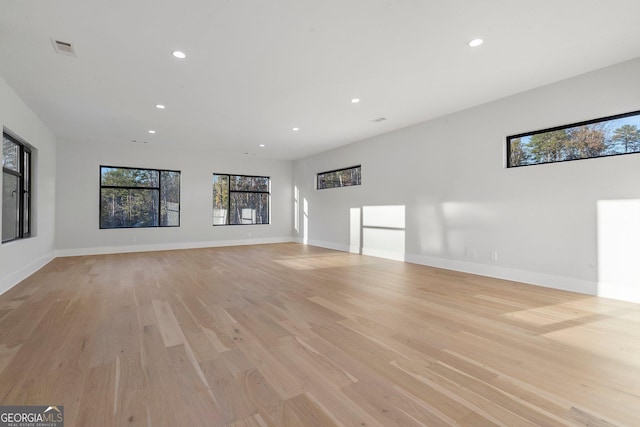 unfurnished living room with light wood-type flooring