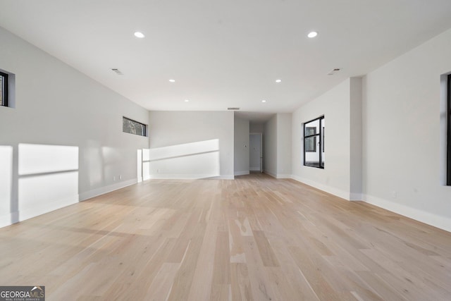 unfurnished living room with light hardwood / wood-style flooring