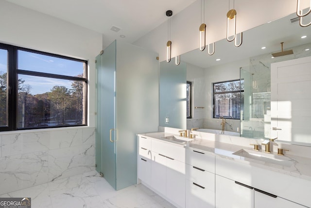 bathroom with vanity and a shower with shower door