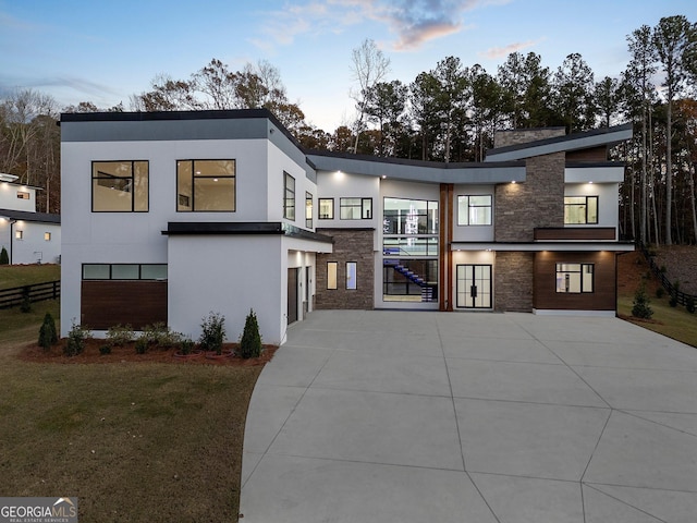 modern home with a lawn